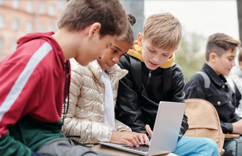 Kids coding on a computer in a coding club