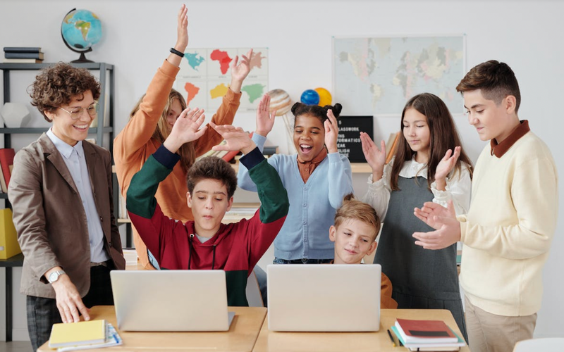 Kids celebrating a school coding club